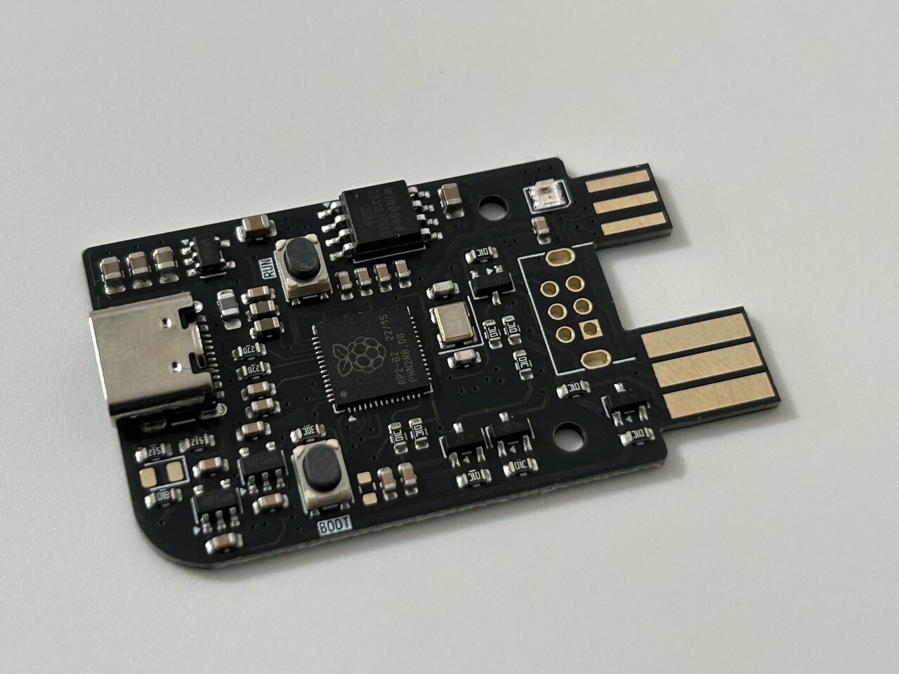 The bare GB-Link circuit board with its RP2040 chip and gold edge connectors